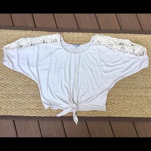 Short sleeved top, lace sleeves.